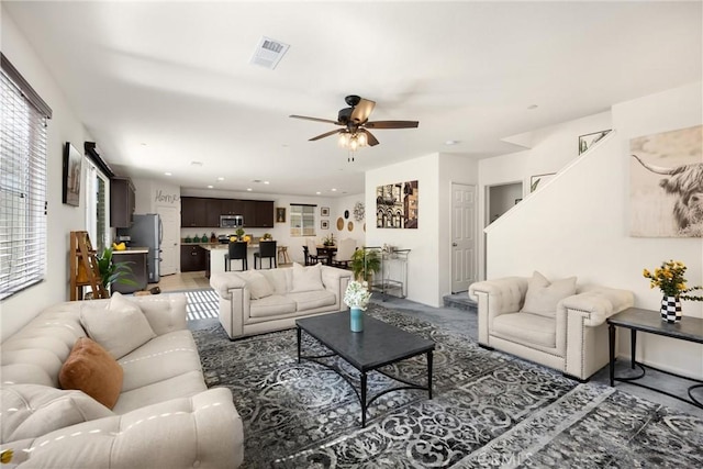 4337 Rima Dr, Fontana, CA 92336 - living room featuring ceiling fan, recessed lighting, and stairs