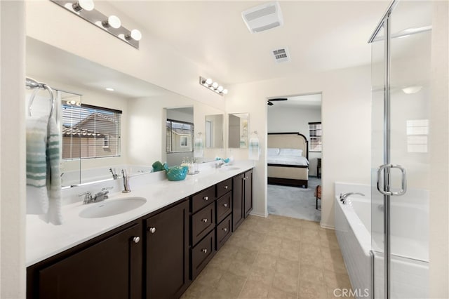 4337 Rima Dr, Fontana, CA 92336 - bathroom with a garden tub, double vanity, connected bathroom, and a stall shower