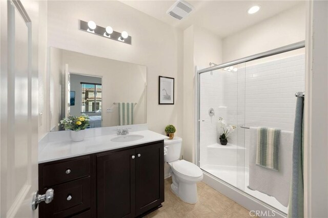 4337 Rima Dr, Fontana, CA 92336 - bathroom featuring toilet, a stall shower, vanity, recessed lighting, and tile patterned flooring