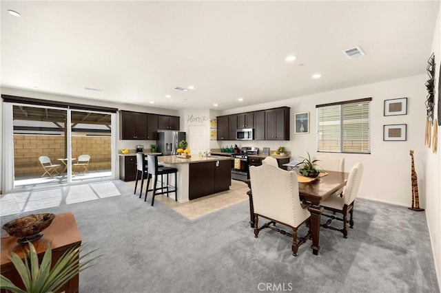 4337 Rima Dr, Fontana, CA 92336 - dining area featuring recessed lighting and light carpet