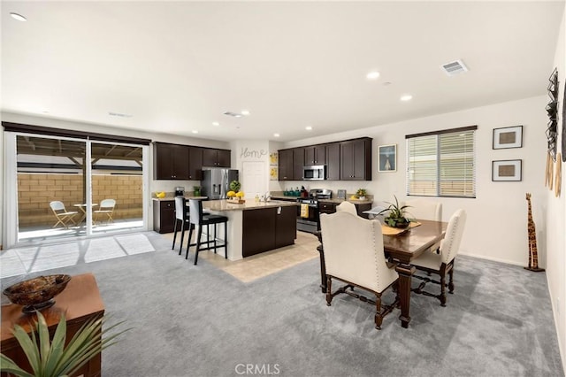 4337 Rima Dr, Fontana, CA 92336 - dining area featuring recessed lighting and light colored carpet