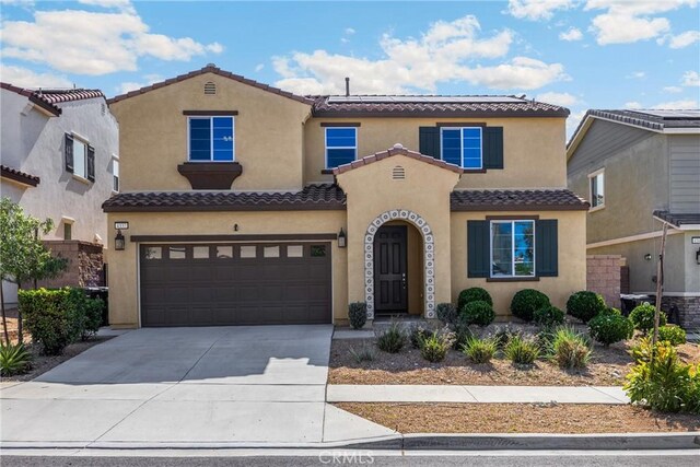 4337 Rima Dr, Fontana, CA 92336 - view of front facade with a tiled roof, stucco siding, and an attached garage