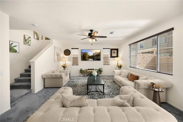 4337 Rima Dr, Fontana, CA 92336 - carpeted living area featuring stairway and ceiling fan
