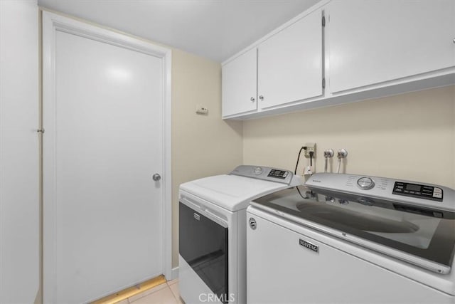 19924 Mildred Ave, Torrance, CA 90503 - laundry room with washer and clothes dryer, cabinet space, and light tile patterned floors