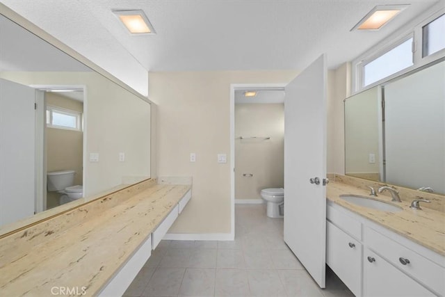 19924 Mildred Ave, Torrance, CA 90503 - full bathroom with toilet, vanity, baseboards, and healthy amount of natural light