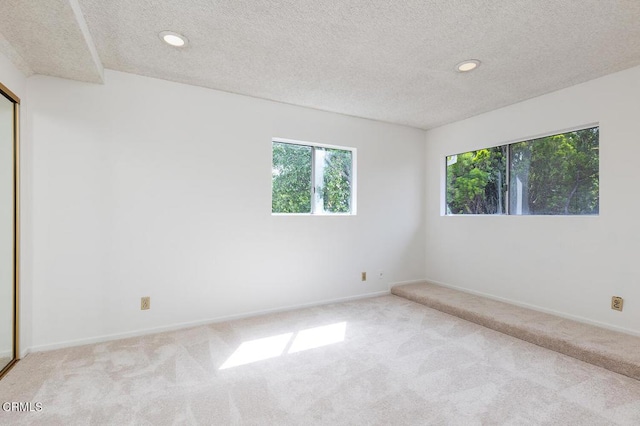 1875 Rose Ave, San Marino, CA 91108 - spare room with carpet flooring, a textured ceiling, recessed lighting, and baseboards