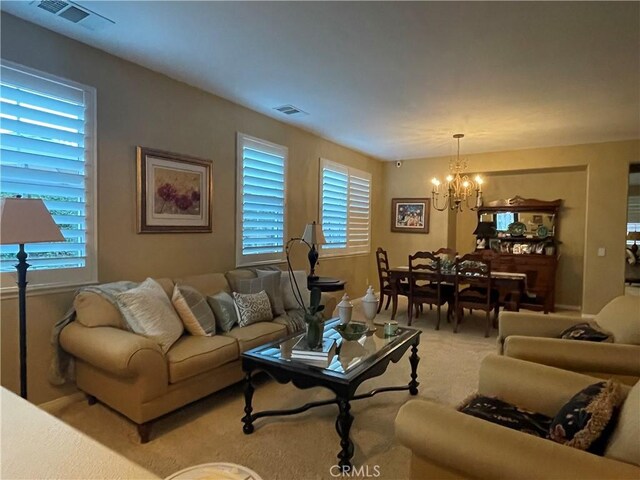 27665 Bottle Brush Way, Murrieta, CA 92562 - living area featuring a chandelier and light carpet