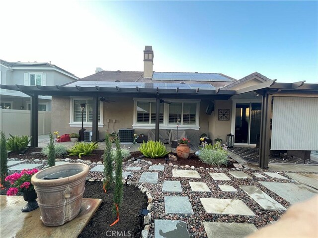 27665 Bottle Brush Way, Murrieta, CA 92562 - rear view of house featuring solar panels, ceiling fan, a patio area, stucco siding, and central AC unit