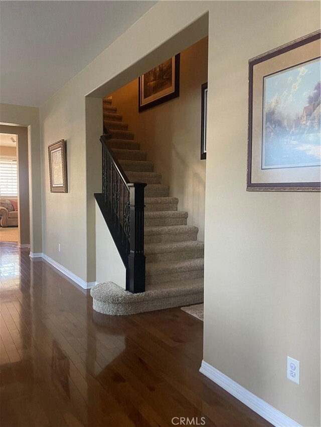 27665 Bottle Brush Way, Murrieta, CA 92562 - staircase with hardwood / wood-style floors and baseboards