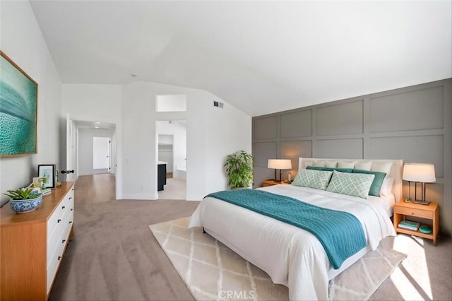 44779 Corte Sanchez, Temecula, CA 92592 - bedroom featuring vaulted ceiling, light carpet, and a decorative wall