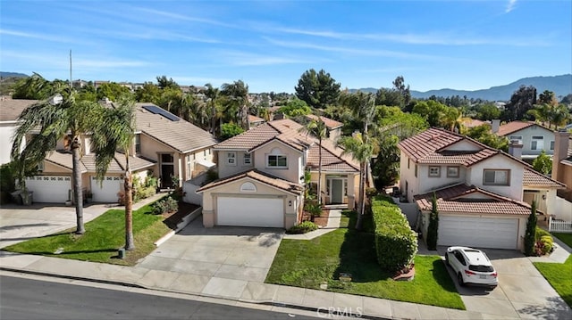 44779 Corte Sanchez, Temecula, CA 92592 - view of front of house featuring a residential view, driveway, a garage, and a front yard