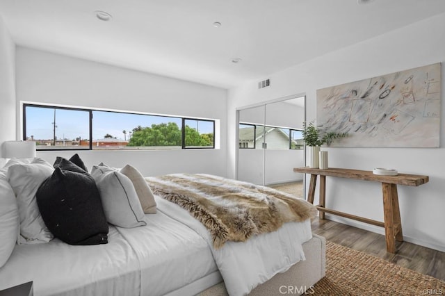 41361/2 Normal Ave Unit 1/2, Los Angeles, CA 90029 - bedroom featuring wood finished floors, a closet, and baseboards