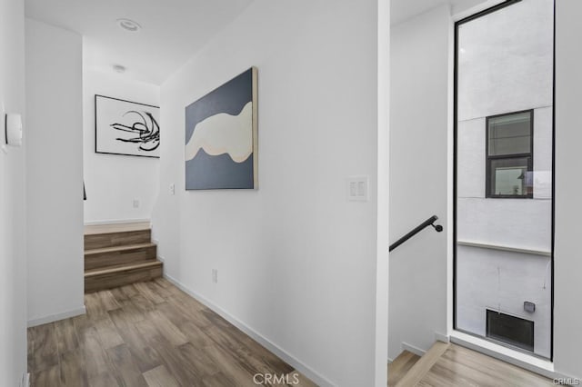 41361/2 Normal Ave Unit 1/2, Los Angeles, CA 90029 - corridor with an upstairs landing, wood finished floors, and baseboards