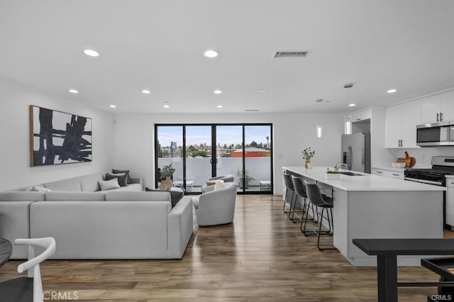 41361/2 Normal Ave Unit 1/2, Los Angeles, CA 90029 - living room with recessed lighting and wood finished floors