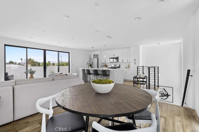 41361/2 Normal Ave Unit 1/2, Los Angeles, CA 90029 - dining space with light wood-style flooring and recessed lighting