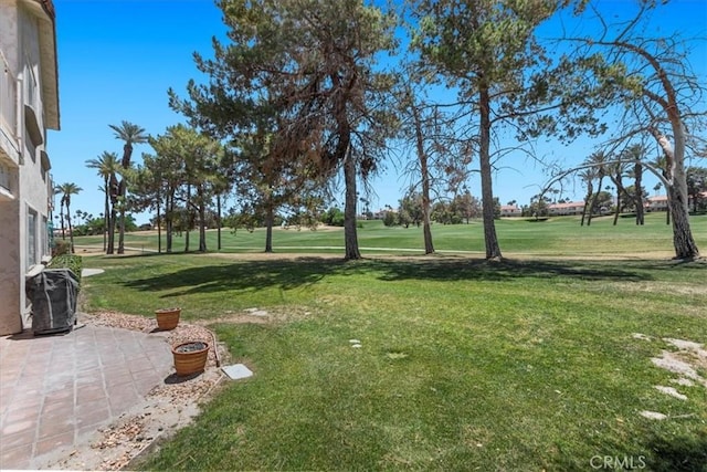 491 Desert Falls Dr N, Palm Desert, CA 92211 - view of grassy yard with a patio