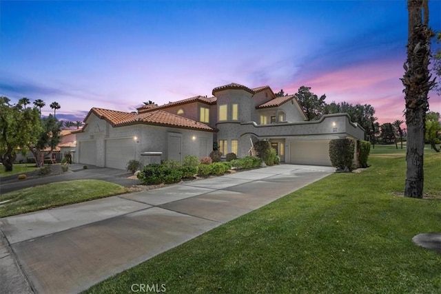 491 Desert Falls Dr N, Palm Desert, CA 92211 - mediterranean / spanish house with concrete driveway, a garage, a tiled roof, and stucco siding