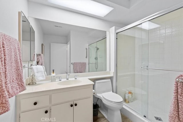 491 Desert Falls Dr N, Palm Desert, CA 92211 - full bathroom with a shower stall, toilet, vanity, and wood finished floors