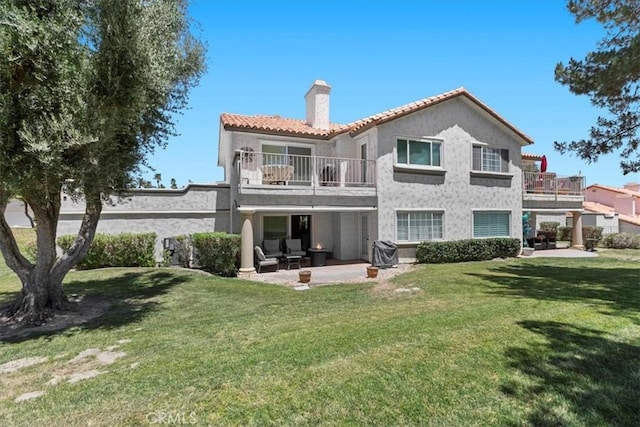 491 Desert Falls Dr N, Palm Desert, CA 92211 - rear view of property featuring a balcony, a chimney, a patio, and stucco siding