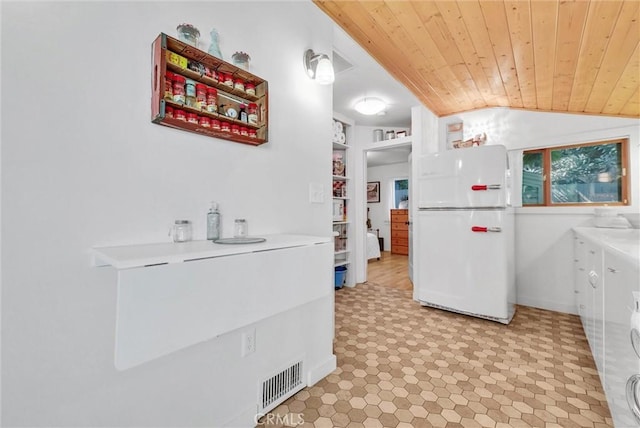 319 W 6th St, Claremont, CA 91711 - kitchen featuring freestanding refrigerator, wooden ceiling, lofted ceiling, light floors, and light countertops