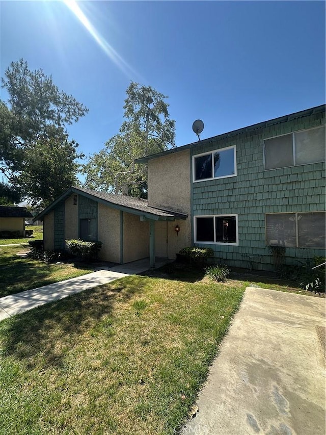 2394 Gonzaga Ln, Riverside, CA 92507 - rear view of property with a lawn