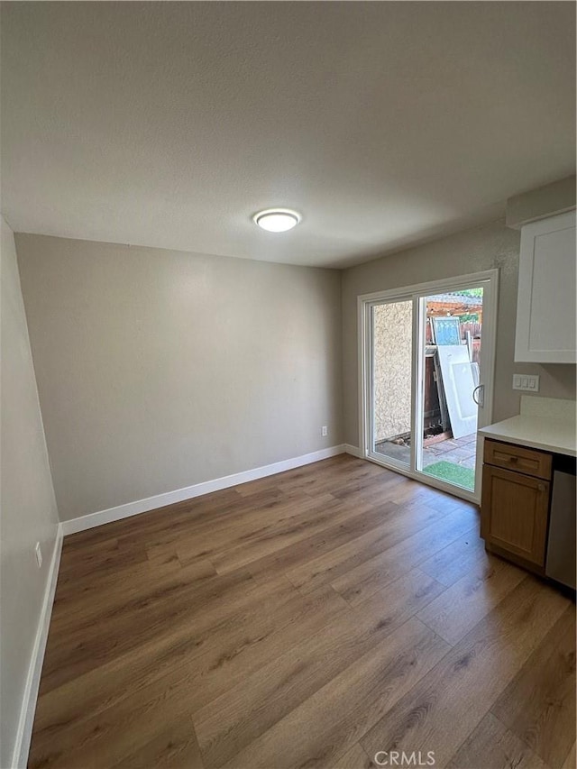 2394 Gonzaga Ln, Riverside, CA 92507 - unfurnished dining area featuring light wood-style floors and baseboards