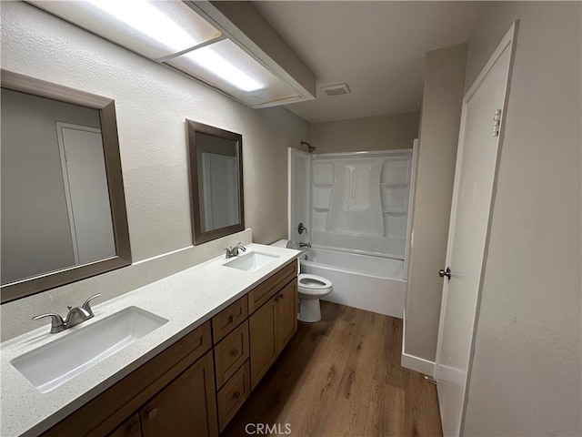 2394 Gonzaga Ln, Riverside, CA 92507 - bathroom with wood finished floors, double vanity, and bathtub / shower combination