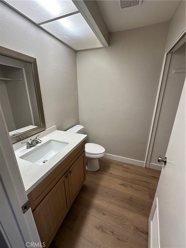 2394 Gonzaga Ln, Riverside, CA 92507 - half bath with wood finished floors and vanity