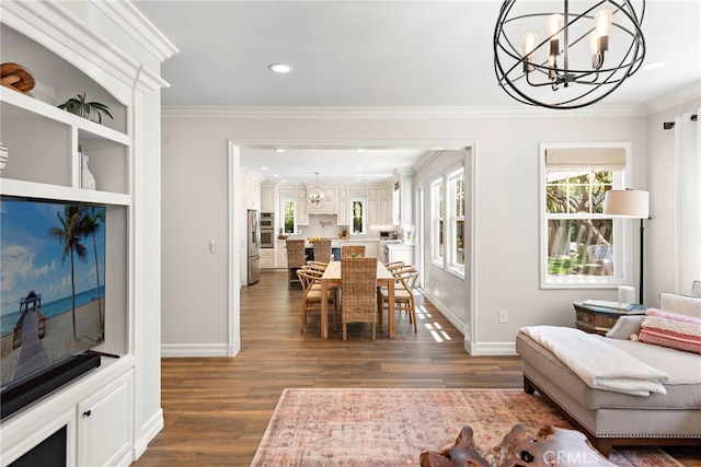 11 Markham Ln, Ladera Ranch, CA 92694 - dining room featuring a chandelier, dark wood-style flooring, crown molding, and recessed lighting