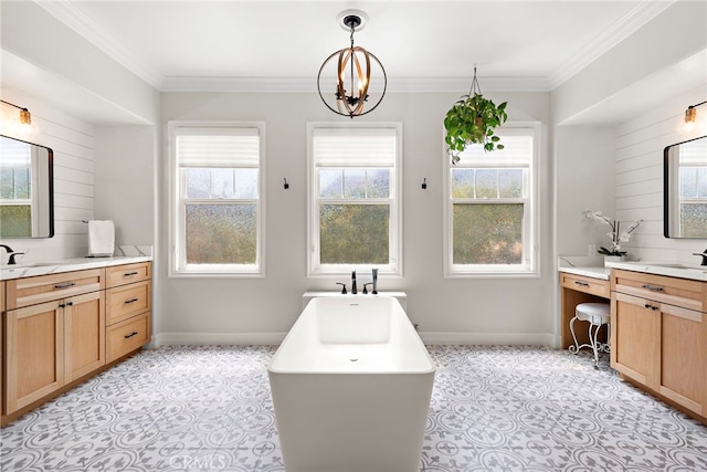 11 Markham Ln, Ladera Ranch, CA 92694 - full bath featuring two vanities, a soaking tub, plenty of natural light, a chandelier, and crown molding
