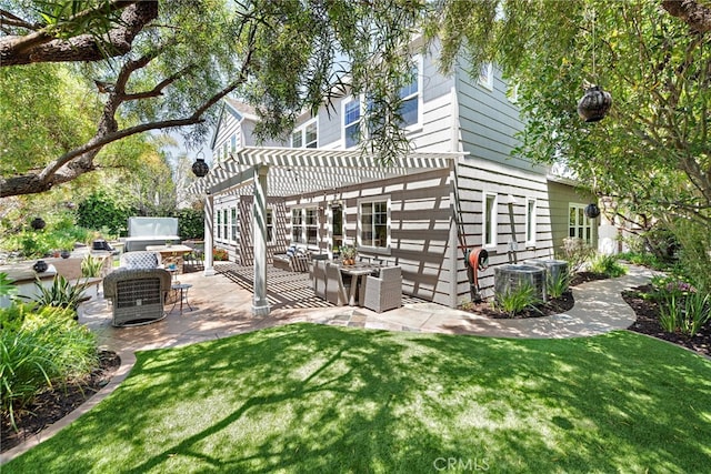 11 Markham Ln, Ladera Ranch, CA 92694 - rear view of property with a pergola, a patio, an outdoor living space, and a lawn