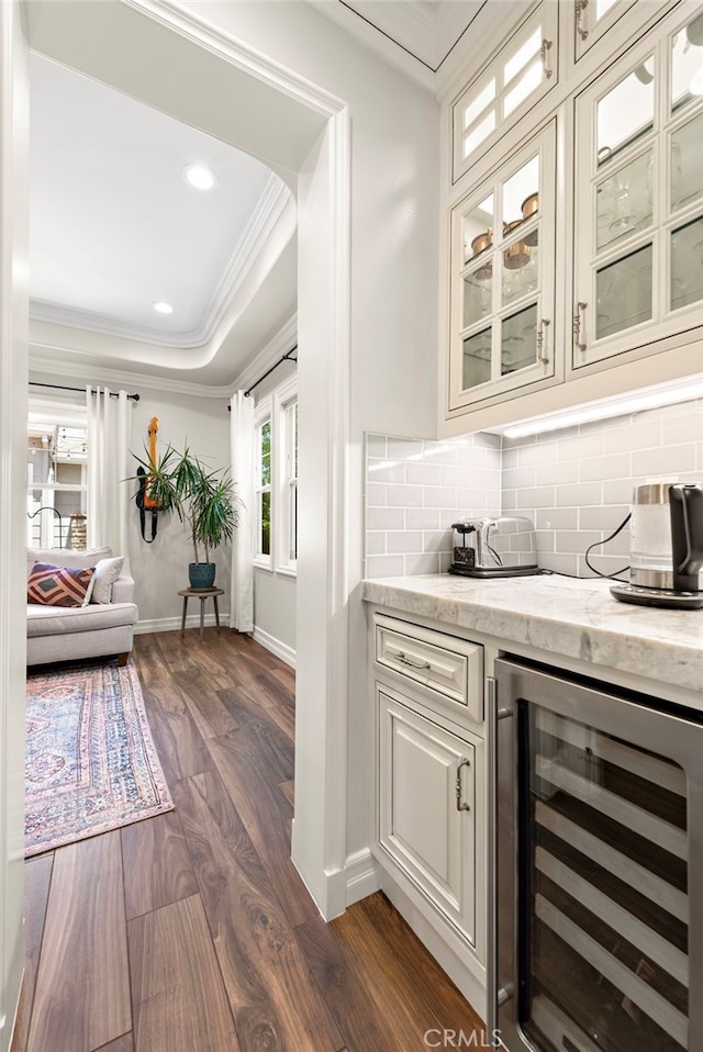 11 Markham Ln, Ladera Ranch, CA 92694 - bar featuring wine cooler, crown molding, dark wood-type flooring, decorative backsplash, and recessed lighting