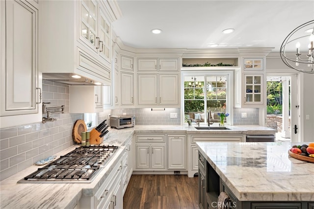 11 Markham Ln, Ladera Ranch, CA 92694 - kitchen featuring a sink, stainless steel gas stovetop, backsplash, white cabinetry, and recessed lighting