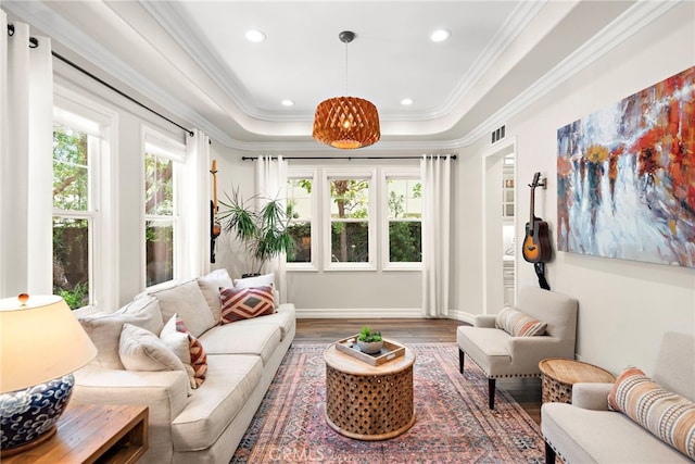 11 Markham Ln, Ladera Ranch, CA 92694 - living area featuring wood finished floors, plenty of natural light, ornamental molding, recessed lighting, and a raised ceiling