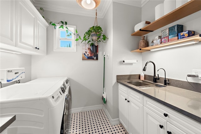 11 Markham Ln, Ladera Ranch, CA 92694 - washroom with washing machine and dryer, baseboards, crown molding, and cabinet space
