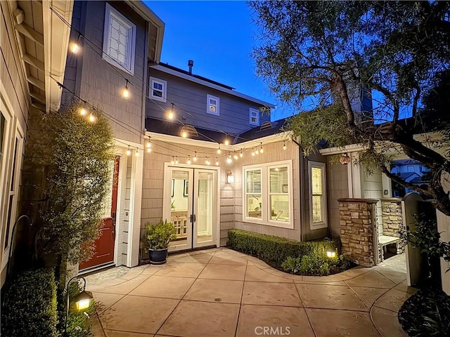 11 Markham Ln, Ladera Ranch, CA 92694 - exterior entry at twilight with french doors and a patio