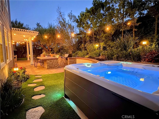 11 Markham Ln, Ladera Ranch, CA 92694 - pool at night featuring a hot tub and a patio area