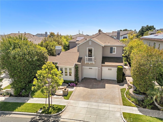 11 Markham Ln, Ladera Ranch, CA 92694 - traditional-style home featuring an attached garage, driveway, a balcony, and a shingled roof
