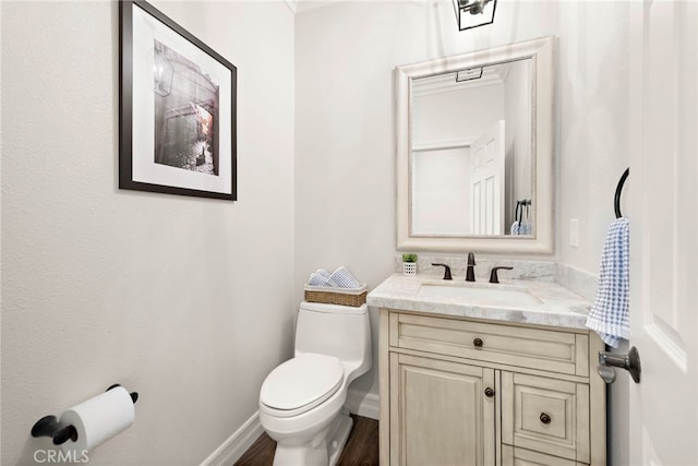 11 Markham Ln, Ladera Ranch, CA 92694 - half bathroom with toilet, vanity, baseboards, and wood finished floors