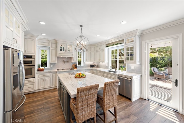 11 Markham Ln, Ladera Ranch, CA 92694 - kitchen featuring stainless steel appliances, dark wood-type flooring, a sink, backsplash, and recessed lighting