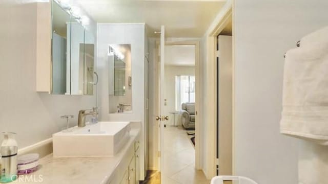 353 N Hermosa Dr Unit 7C1, Palm Springs, CA 92262 - bathroom featuring tile patterned flooring and vanity