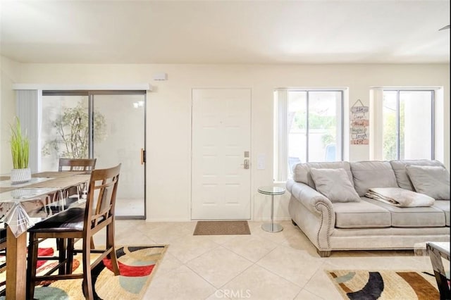 353 N Hermosa Dr Unit 7C1, Palm Springs, CA 92262 - living room featuring light tile patterned flooring and baseboards
