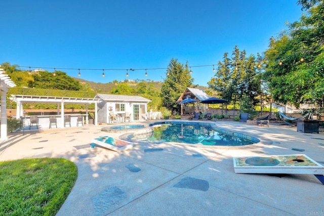 2507 Walinca Way, Vista, CA 92084 - view of swimming pool featuring a patio area, an outbuilding, and a pool with connected hot tub