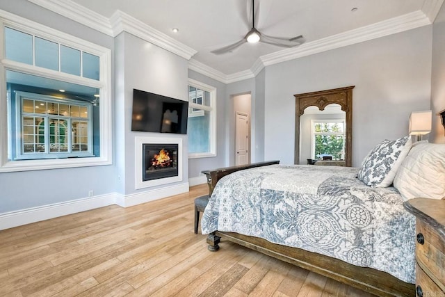 2507 Walinca Way, Vista, CA 92084 - bedroom with a warm lit fireplace, wood-type flooring, baseboards, ornamental molding, and a ceiling fan
