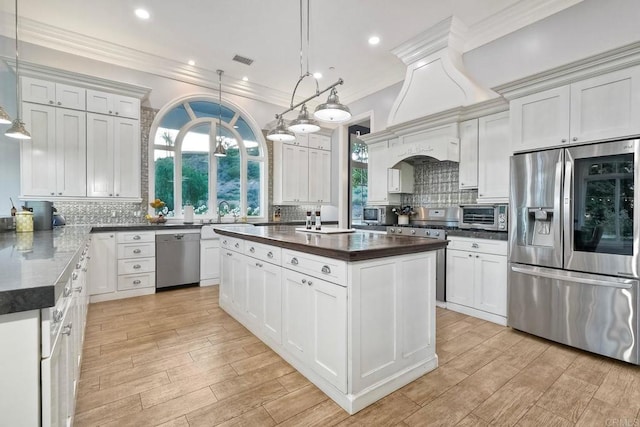 2507 Walinca Way, Vista, CA 92084 - kitchen with stainless steel appliances, backsplash, a sink, plenty of natural light, and crown molding