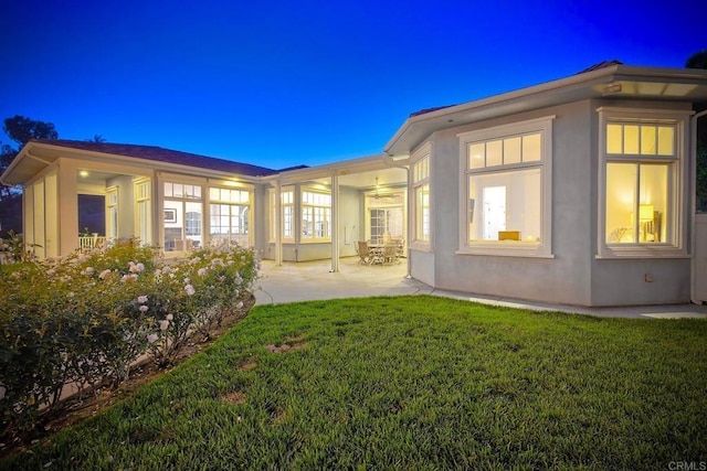 2507 Walinca Way, Vista, CA 92084 - rear view of property with a patio, a lawn, and stucco siding