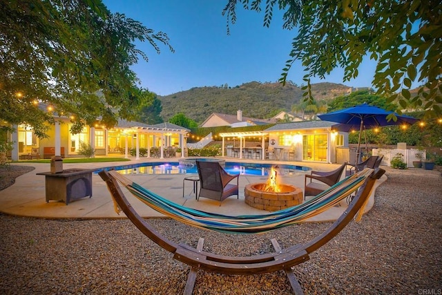 2507 Walinca Way, Vista, CA 92084 - outdoor pool with a fire pit, a patio area, and a mountain view