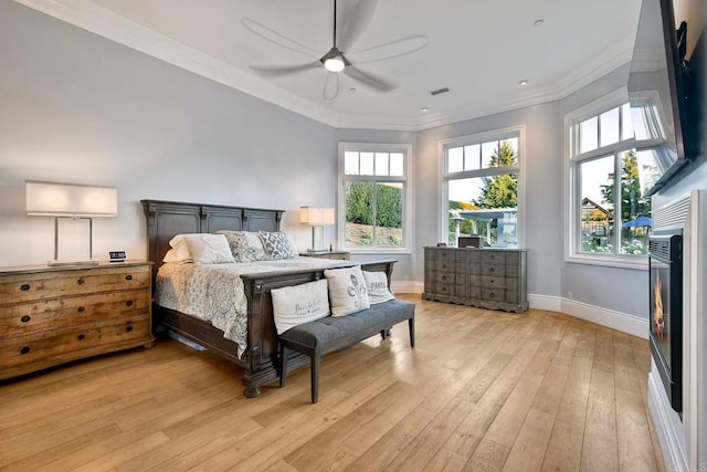 2507 Walinca Way, Vista, CA 92084 - bedroom with light wood finished floors, a warm lit fireplace, baseboards, crown molding, and a ceiling fan