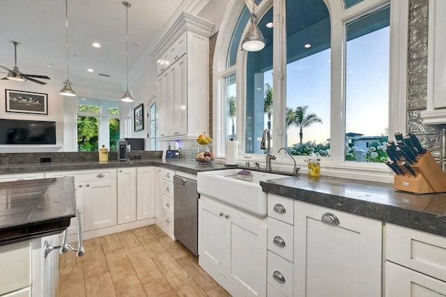 2507 Walinca Way, Vista, CA 92084 - kitchen with stainless steel dishwasher, a sink, ceiling fan, white cabinetry, and ornamental molding