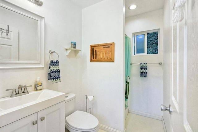 2507 Walinca Way, Vista, CA 92084 - full bathroom featuring toilet, a shower stall, vanity, and baseboards